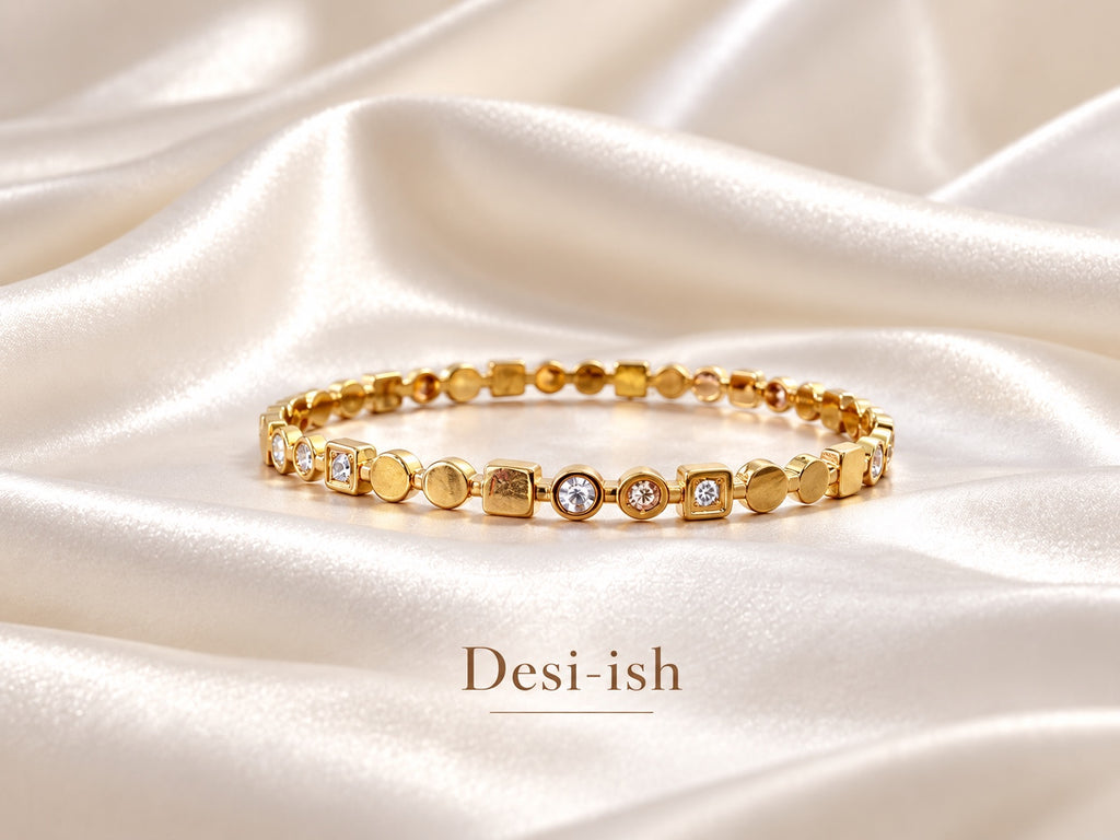 Clear crystal kada laid flat on white satin