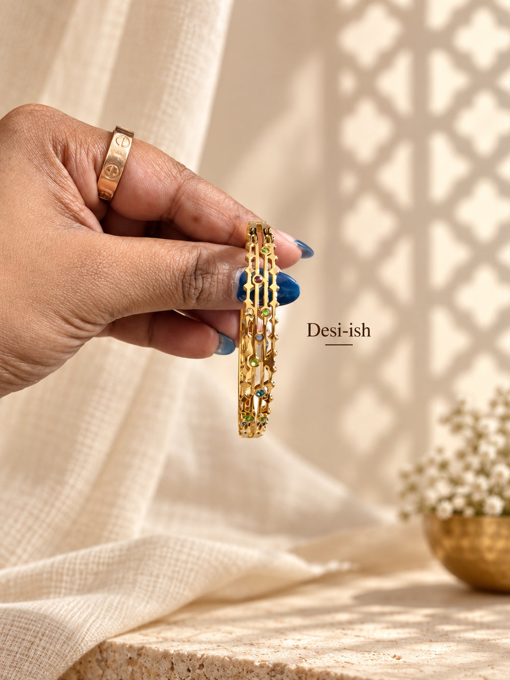 Desi-ish multicolour geometric anti-tarnish kada hand-held view