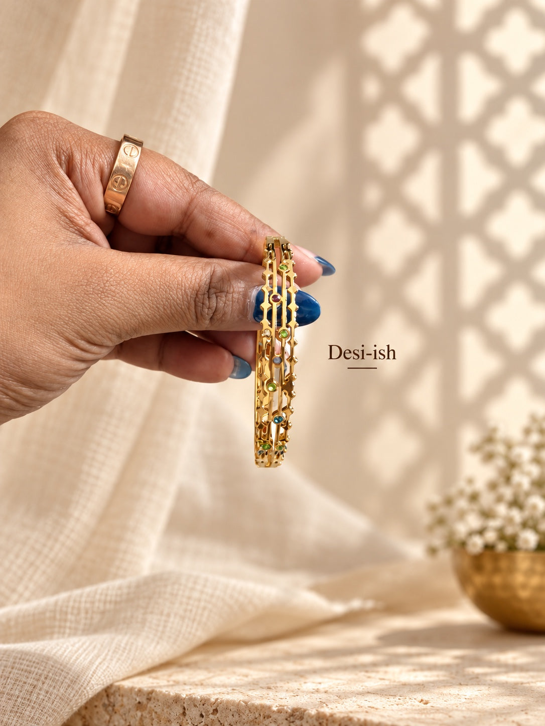 Desi-ish multicolour geometric anti-tarnish kada hand-held view